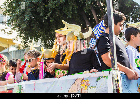 LIMASSOL, CYPRUS - FEBRUARY 26: Happy people in teams dressed with colorfull costumes at famous, February 26, 2017 in Limassol Stock Photo