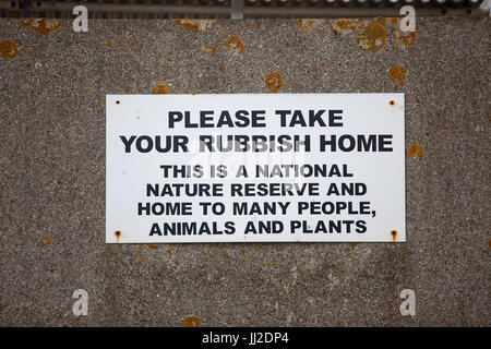 Please take your rubbish home sign seen on the Dungeness national nature reserve, Kent Stock Photo