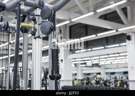 Closeup picture of hanging handle machine in a gym for pulling training. Stock Photo