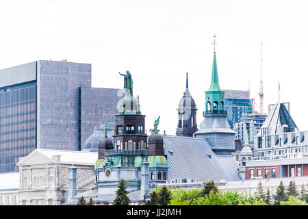 Montreal, Canada - May 27, 2017: Old port area with view of skyline or cityscape and Bonsecours chapel Stock Photo