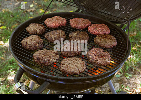 Hamburgers on a charcoal grill Stock Photo