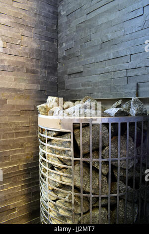 Beautiful sauna interior with heater and stones. electric sauna heater in  steam room. close up view Stock Photo - Alamy