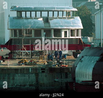 AJAXNETPHOTO. 2003. PLYMOUTH, ENGLAND. - DML PROJECT TAKES SHAPE - THE ALUMINIUM WHEELHOUSE AND FORWARD LOUNGE AREA SUPERSTRUCTURE FOR DML'S LATEST  PROJECT AWAITS A LIFT ONTO THE HULL AT DEVONPORT AT THE END OF SEPT. 2003.  THE 77M STEEL HULL IS SAID TO BE THE LARGEST HULL FOR A PRIVATE OWNER BUILT IN THE UK SINCE THE ROYAL YACHT BRITANNIA OF 1953, AND IS THE LAST HULL BUILT BY APPLEDORE SHIPYARD.  PHOTO:JONATHAN EASTLAND/AJAX REF:309312 52 Stock Photo