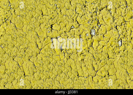 Peeling paint on wall seamless texture. Pattern of rustic yellow grunge material. Stock Photo