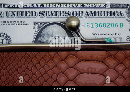 Berlin, Germany. 23rd Mar, 2017. ILLUSTRATION - A one-dollar bill sticking out of an open purse. Taken on 23.03.2017. - NO WIRE SERVICE - Photo: Sascha Steinach/dpa-Zentralbild/dpa | usage worldwide/dpa/Alamy Live News Stock Photo