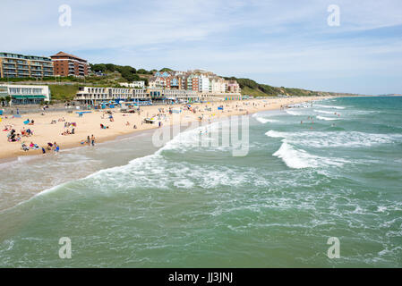 Boscombe, Bournemouth, Dorset, UK, 18th July 2017. It’s hot, humid and breezy at the English south coast resort with temperatures in the high twenties and thunderstorms expected later. People are out on the seafront, on the beach and in the sea enjoying the weather which will turn cooler for the rest of the week. Credit: Paul Biggins/Alamy Live News