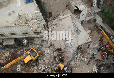 View of venue after building collapse in locality of Liaquatabad area in Karachi on Tuesday, July 18, 2017. At least five people, including two children, were killed and nine injured as a three-storey building collapsed in Liaquatabad area of Karachi late on Monday. Stock Photo