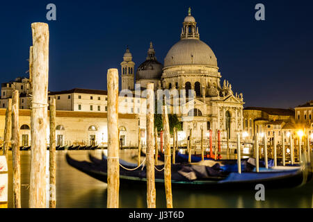 Church Santa Maria della Salute with gondolas at night, Venice, Veneto, Italy Stock Photo