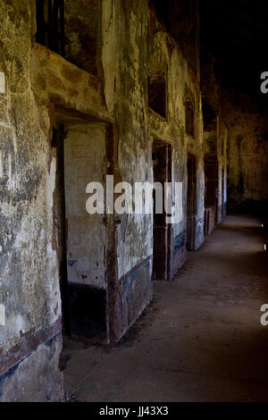 Former prison cells of  notorious penal colony on Salvation's Islands (French Guiana). Henri Charriere was held there. Stock Photo
