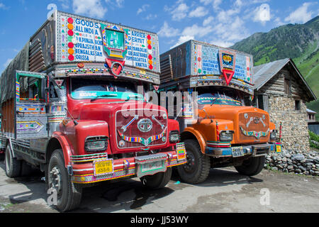 Jammu and Kashmir, India. Two trucks parked outside Sonamarg. Part of a convoy waiting to depart for Kargil. Stock Photo