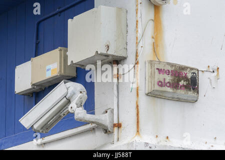 Two CCTV surveillance / security cameras mounted on building corner - metaphor for 'big brother is watching you' concept, and mass surveillance. Stock Photo