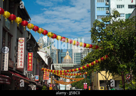 16.07.2017, Singapore, Republic of Singapore, Asia - A street in Singapore's Chinatown district with the skyline of the Central Business District. Stock Photo