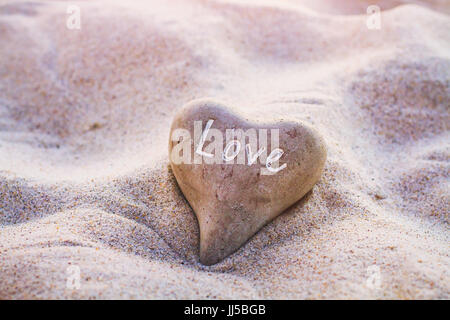 love concept, heart on the sand, beautiful valentines day card, vintage colors Stock Photo