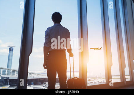 travel concept, business man silhouette in airport Stock Photo