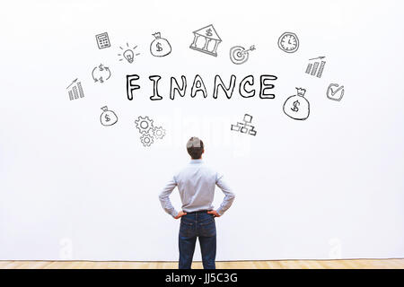 finance concept, business man looking at drawn word on white background Stock Photo