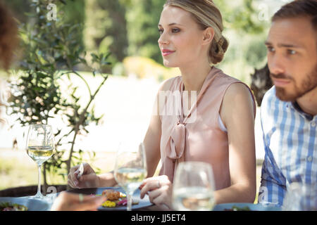 Close-up of couple having meal in restaurant Stock Photo