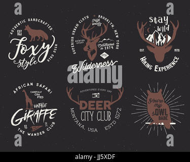 Wild animal badges set. Included giraffe, owl, fox and deer shapes. Stock isolated on dark background. Good for tee designs Stock Photo