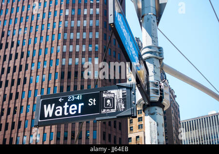 Street signs show Water St. at Vietnam Veterans Plaza in Lower Manhattan's Financial District Stock Photo