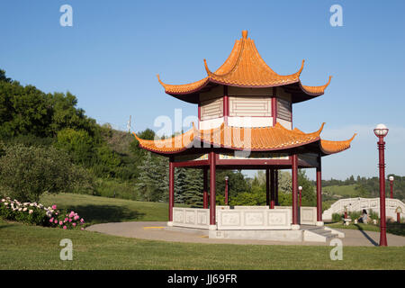 Chinese Garden pavilion at Louise McKinney Park in spring with clear blue sky, Edmonton river valley, Alberta, Canada Stock Photo