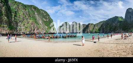 KRABI, THAILAND - DECEMBER 4 : Colorful long tail boats at beautiful beach on a background of blue sky and azure sea and limestone rocks, Phi Phi Isla Stock Photo