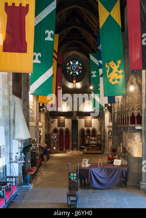 The Great Hall of the Hammond Castle, in Gloucester, Massachusetts. Colorful banners of arms are hanging from the high ceilings. Stock Photo