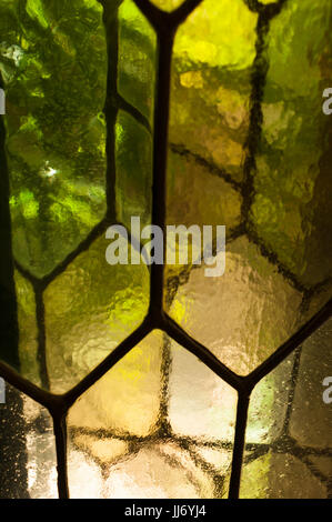 Leadlight windows with hexagonal panes and textured cathedral glass, at Hammond Castle, in Gloucester, Massachusetts. Stock Photo