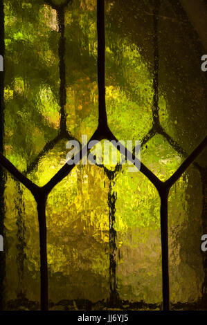 Leadlight windows with hexagonal panes and textured cathedral glass, at Hammond Castle, in Gloucester, Massachusetts. Stock Photo