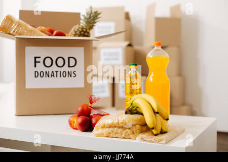 Grey big box packed with food donations Stock Photo