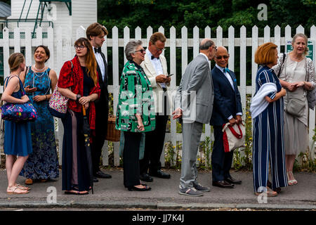 Opera fans including broadcaster and former MP Michael Portillo arrive at Lewes railway station enroute to Glyndebourne Opera House, Lewes, Sussex, UK Stock Photo