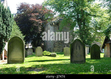 graveyard and historic vicars or priests pele tower house in Corbridge Stock Photo