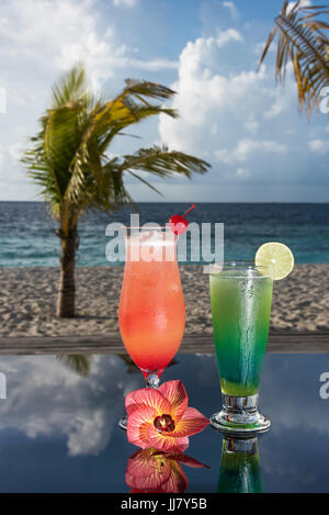 Two cocktails in a beach whit flower Stock Photo