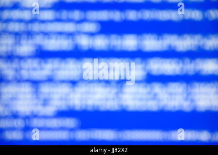 Blue screen of system crash report. Defocused background Stock Photo