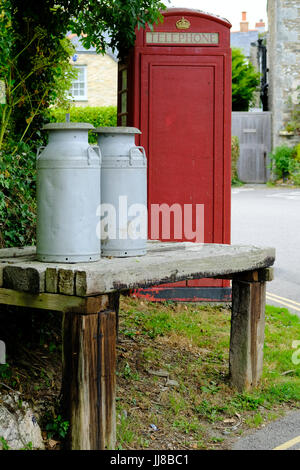 Telephone box and milk churns, Crantock, Cornwall Stock Photo