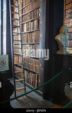 Sliding ladder in the long room library in Trinity College, Dublin Ireland. Book of Kells Stock Photo