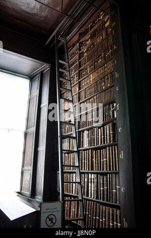 Sliding ladder in the long room library in Trinity College, Dublin Ireland. Book of Kells Stock Photo