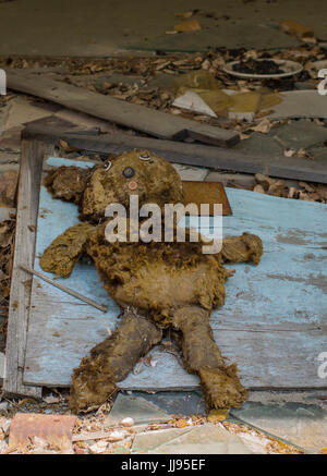 Abandoned Doll in Derelict House in Ghost City of Pripyat in Chernobyl Exclusion Zone Stock Photo