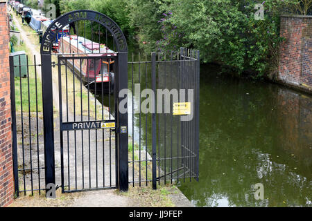 Gated security for the Engine Arm Residential Moorings on a dead-end arm of the Birmingham Canal Navigation in Smethwick, West Midlands, Uk Stock Photo