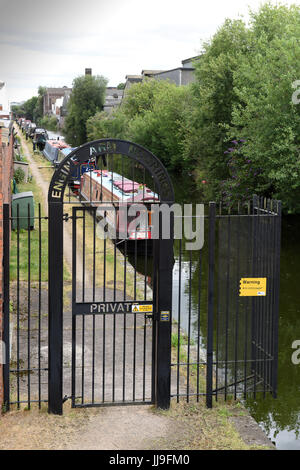 Gated security for the Engine Arm Residential Moorings on a dead-end arm of the Birmingham Canal Navigation in Smethwick, West Midlands, Uk Stock Photo