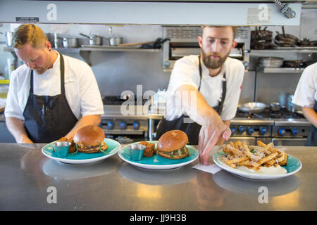 Chefs at work in Nomad Restaurant, Vancouver, Canada Stock Photo
