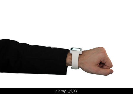 Cropped hand of businessman wearing smart watch against white background Stock Photo