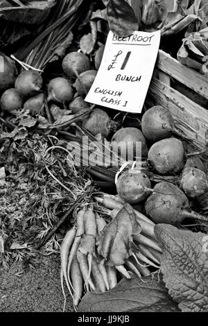 black and white photograph of beetroot on sale in market at one pound per bunch Stock Photo