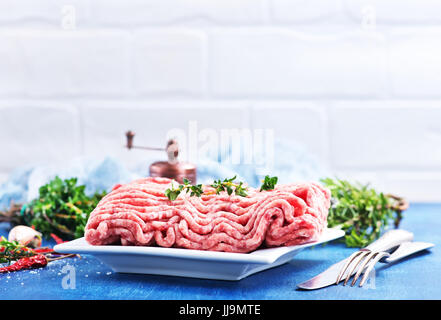 minced meat on plate and on a table Stock Photo