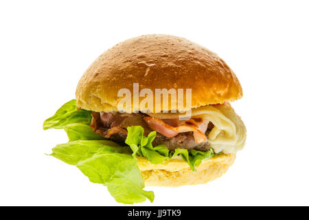 burger with cheese ham lettuce mayo and ketchup against white background Stock Photo