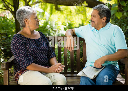 Senior couple hugging each other at the park Stock Photo