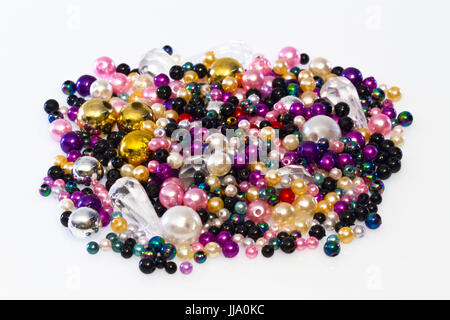 Colorful plastic beads in Detail on bright Background Stock Photo