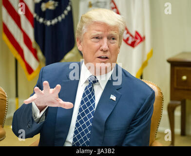 Washington, USA. 18th Jul, 2017. United States President Donald J. Trump makes remarks to the press prior to having lunch with four veterans of Afghanistan in the Roosevelt Room of the White House in Washington, DC on Tuesday, July 18, 2017. In his remarks the President said he was 'disappointed' about the GOP failure to pass a healthcare bill and said his plan was to 'let Obamacare fail. Credit: MediaPunch Inc/Alamy Live News Stock Photo