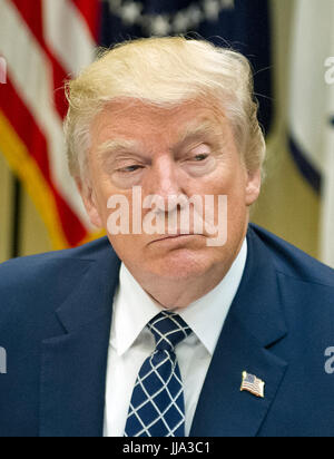 Washington, USA. 18th Jul, 2017. United States President Donald J. Trump makes remarks to the press prior to having lunch with four veterans of Afghanistan in the Roosevelt Room of the White House in Washington, DC on Tuesday, July 18, 2017. In his remarks the President said he was 'disappointed' about the GOP failure to pass a healthcare bill and said his plan was to 'let Obamacare fail. Credit: MediaPunch Inc/Alamy Live News Stock Photo