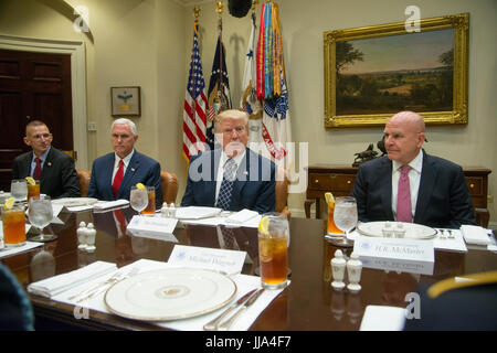 Washington DC, USA. 18th Jul, 2017. President Donald J Trump has lunch with Service members in the White House. He is joined by Vice President Mike Pense and National Security Advisor, H.R. McMaster. Trump demanded that the Senate repeal the Affordable Care Act (ACT), also known as 'Obamacare' Patsy Lynch/Alamy Credit: Patsy Lynch/Alamy Live News Stock Photo