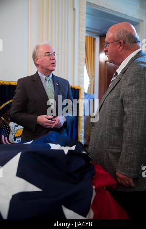 Washington, United States Of America. 18th July, 2017. U.S HHS Secretary Tom Price, left, chats with a manufacturer during a Made in America product showcase featuring items created in each of the 50 states in the East Room of the White House July 17, 2017 in Washington, DC. Credit: Planetpix/Alamy Live News Stock Photo