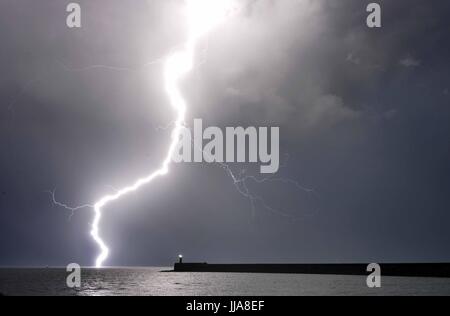 Newhaven, East Sussex. 19th July 2017. Dramatic display of lightning over the English Channel as summer storms bring torrential rain to the South East. © Peter Cripps/Alamy Live News